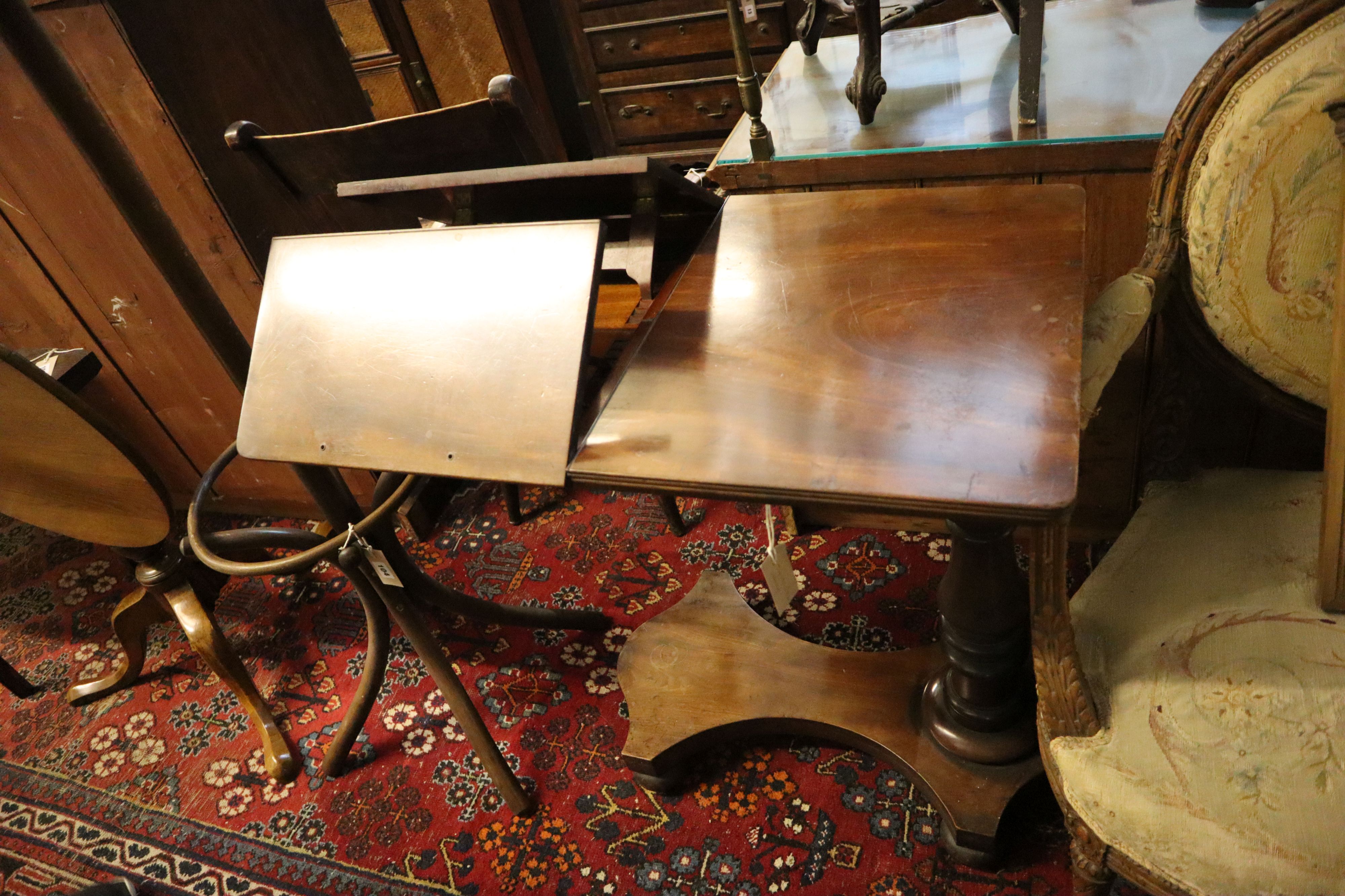 A Victorian mahogany adjustable reading table, the top fitted two adjustable sections, width 82cm, depth 50cm, height 78cm